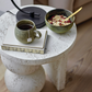 Resin Table with Stacked Ball Base, Travertine Finish, Cream Color